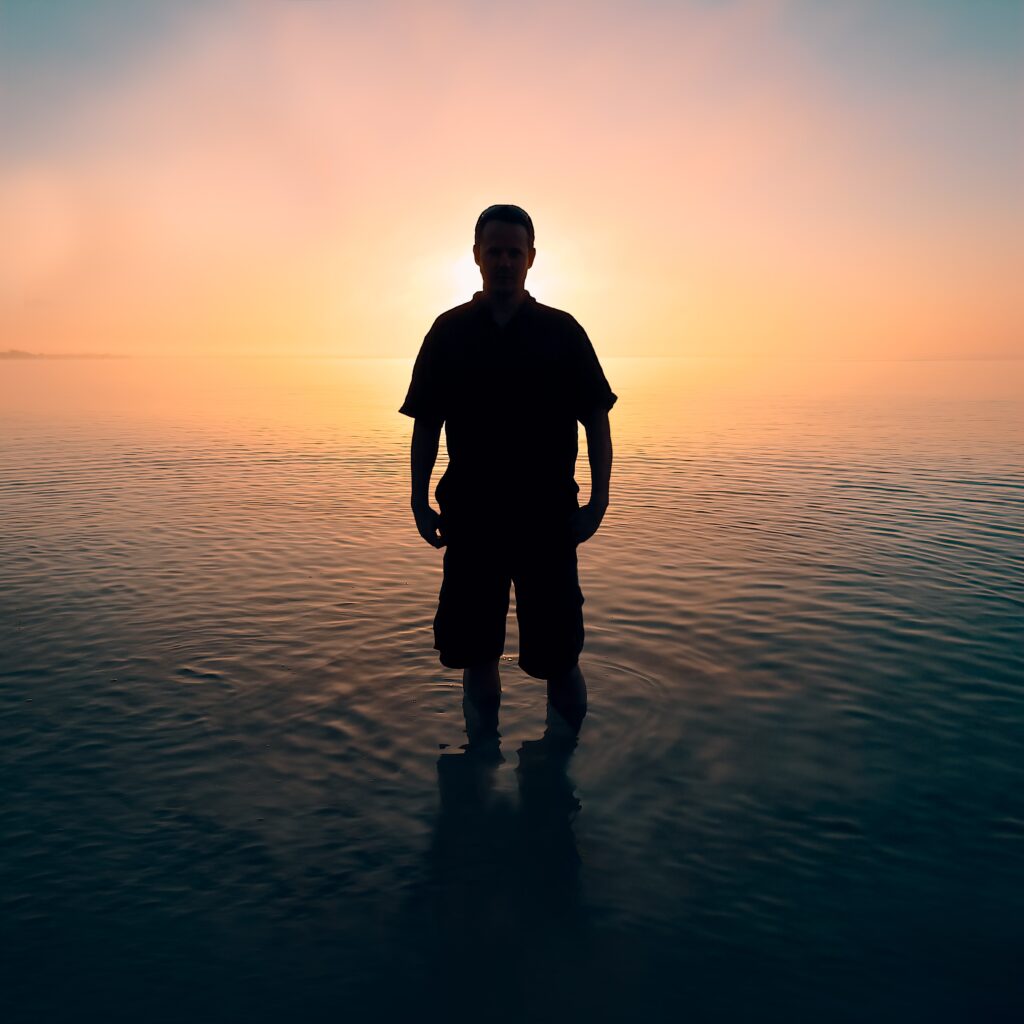 Categories: Man with background of sunset.